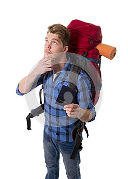 Young backpacker tourist holding passport carrying backpack thinking on travel destination