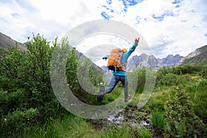 Young backpacking woman hiking