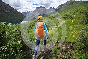 Woman walking in high altitude mountains