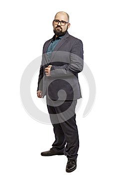 Young bald bearded man with glasses and a full-length suit. Isolated over white background.