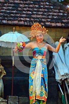 Young Balinese female dancer performing traditional dance