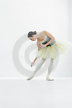 young ballerina practicing choreographic elements during