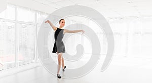 Young ballerina practising ballet moves