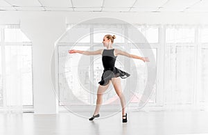 Young ballerina practising ballet moves