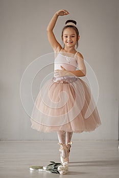 Young ballerina stands on pointes