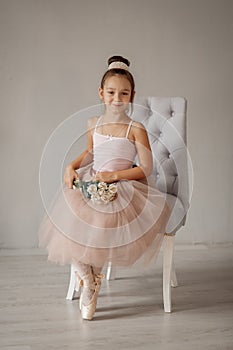 Young ballerina stands on pointes photo