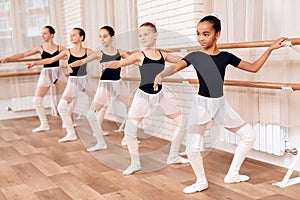 Young ballerinas rehearsing in the ballet class.