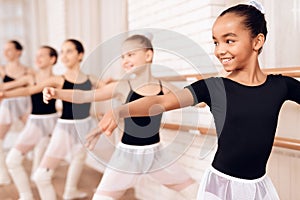 Young ballerinas rehearsing in the ballet class.