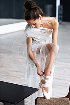 Young ballet dancer - Harmonious pretty woman posing in studio