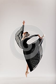 Young ballet dancer isolated on white background