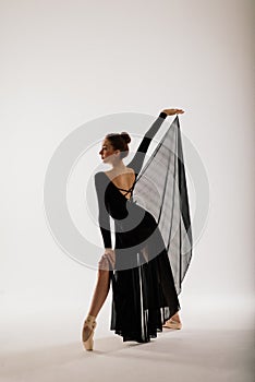 Young ballet dancer  on white background