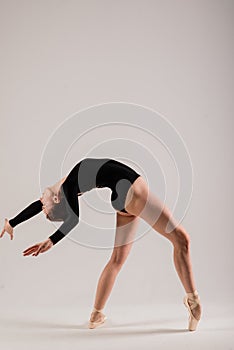 Young ballet dancer  on white background