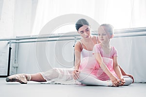 young ballet teacher training with cute little child