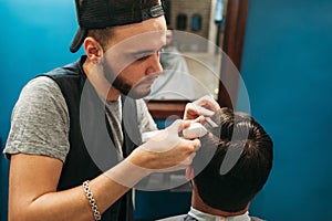 Young barber cut man hair free space