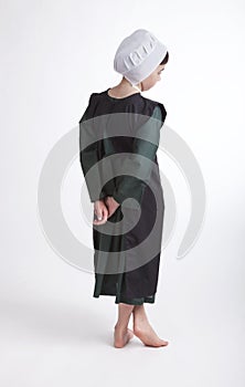 Young barefoot Amish girl isolated on a background