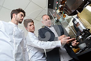 Young baristas learning to make coffee