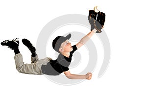 Young baseball player diving to catch fly ball