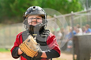 Young baseball player wearing catcher gear