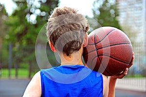 Young basketball player with a ball