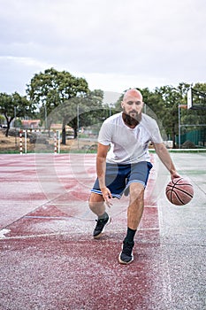 Young basketball player dribbling the ball