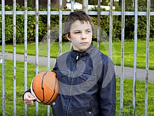 Young basketball player holding ball