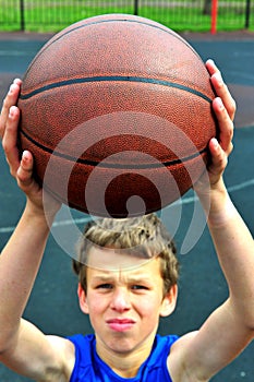 Young basketball player preparing to throw ball