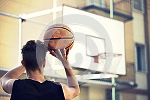 Young basketball player ready to shoot