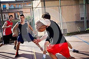 Young basketball players playing with energy