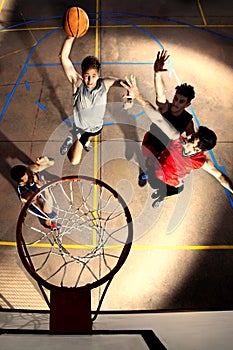 Young basketball players playing with energy and power