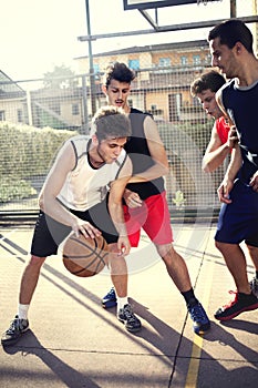 Young basketball players playing with energy