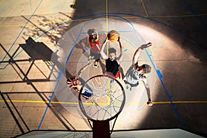 Young basketball players playing with energy photo