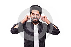 Young bearded arab man covering his ears isolated on white background