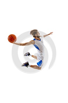 Young bearded man, competitive basketball athlete practicing, training isolated on white background