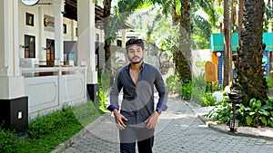 Young bearded man doing a small walk at a park