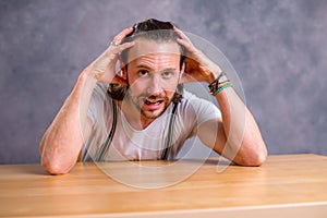 Young bearded man lokking amazed