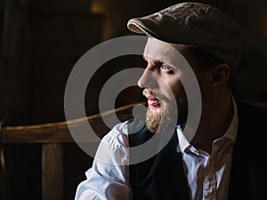 Young bearded man in a pub, vintage style