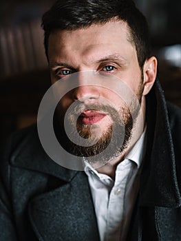 Young bearded man in a pub, vintage style