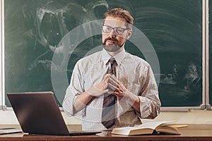 Young Bearded Teacher Listening to His Students` Answers
