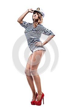 Young Beautiful Adorable Woman in sea peak-cap and stripped vest