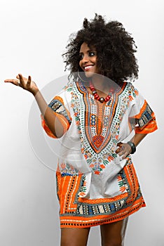 Young beautiful African woman with Afro hair wearing traditional clothes