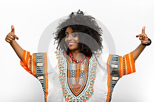 Young beautiful African woman with Afro hair wearing traditional clothes