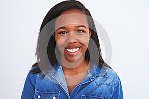 Young beautiful african woman wearing casual denim shirt over isolated white background with a happy face standing and smiling