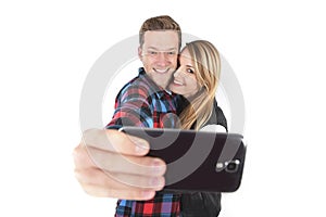 Young beautiful American couple in love taking romantic self portrait selfie photo together with mobile phone