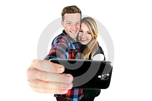 Young beautiful American couple in love taking romantic self portrait selfie photo together with mobile phone