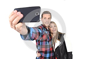 Young beautiful American couple in love taking romantic self portrait selfie photo together with mobile phone