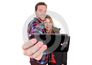 Young beautiful American couple in love taking romantic self portrait selfie photo together with mobile phone