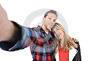 Young beautiful American couple in love taking romantic self portrait selfie photo together with mobile phone