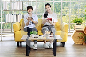 Young and beautiful Asain women sitting and demonstrat and communicate with hand sign, deaf language