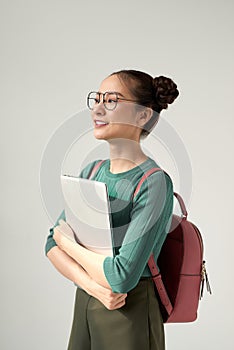 A Young Beautiful asian College Student Holding Laptop on Isolated White Background