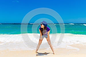 Young beautiful Asian girl on a tropical beach. Summer vacation